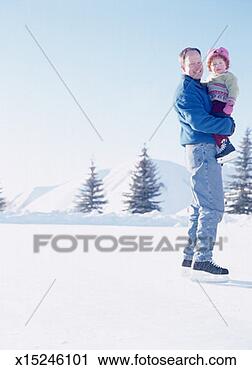 Stock Photography - portrait of father 
on ice skates, 
holding 3-year-old 
daughter. fotosearch 
- search stock 
photos, pictures, 
images, and photo 
clipart