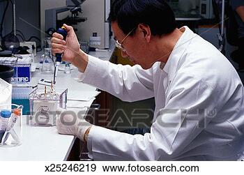 Stock Photograph - chemist using 
a pipette in a 
laboratory. fotosearch 
- search stock 
photos, pictures, 
images, and photo 
clipart