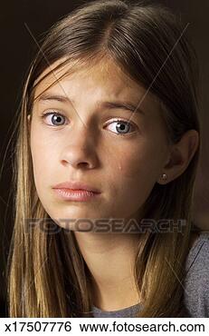 Stock Photo - a caucasian preteen 
girl with long 
brown hair is 
looking depressed. 
fotosearch - search 
stock photos, 
pictures, images, 
and photo clipart