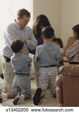 Stock Photography - a christian family 
gathers in a circle 
for family prayer. 
fotosearch - search 
stock photos, 
pictures, images, 
and photo clipart