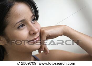 Stock Photograph - head and shoulders 
shot of smiling 
woman, close-up. 
fotosearch - search 
stock photos, 
pictures, images, 
and photo clipart