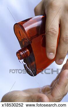 Stock Photo - close-up of human 
hands pouring 
perfume. fotosearch 
- search stock 
photos, pictures, 
images, and photo 
clipart
