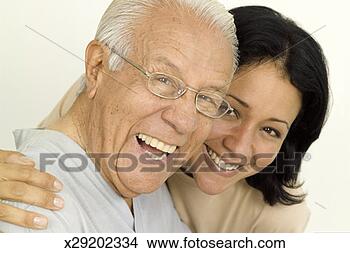 Stock Photo - portrait of smiling 
senior man and 
young woman, close-up. 
fotosearch - search 
stock photos, 
pictures, images, 
and photo clipart