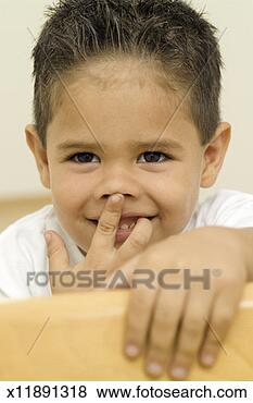 Stock Photo - young boy making 
a funny face. 
fotosearch - search 
stock photos, 
pictures, images, 
and photo clipart