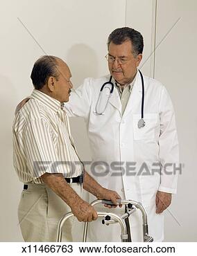 Stock Photo - male doctor standing 
with a male patient, 
holding a walker. 
fotosearch - search 
stock photos, 
pictures, images, 
and photo clipart