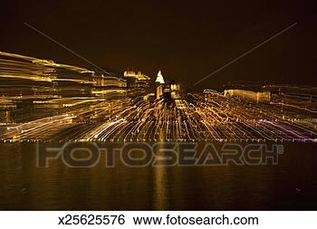 Stock Photo - blurred image 
of brightly lit 
building at night 
in new york city. 
fotosearch - search 
stock photos, 
pictures, images, 
and photo clipart