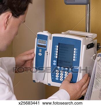 Stock Photography - doctor setting 
up medical equipment. 
fotosearch - search 
stock photos, 
pictures, images, 
and photo clipart