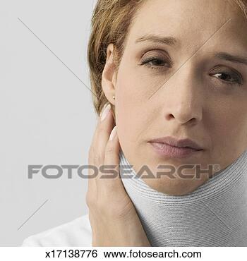 Stock Photo - mid adult woman 
in neck brace. 
fotosearch - search 
stock photos, 
pictures, images, 
and photo clipart