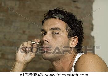 Stock Photo - side profile of 
a man smoking 
a joint. fotosearch 
- search stock 
photos, pictures, 
images, and photo 
clipart