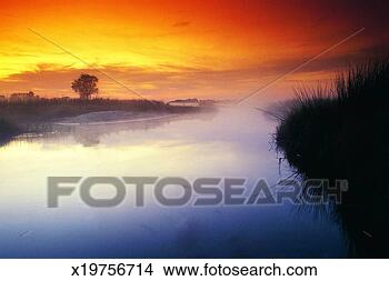 Stock Photo - sunrise, okavango 
delta, botswana, 
africa. fotosearch 
- search stock 
photos, pictures, 
images, and photo 
clipart