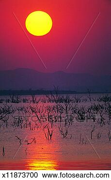 Stock Photography - sunset over lake 
kariba, zimbabwe, 
africa. fotosearch 
- search stock 
photos, pictures, 
images, and photo 
clipart