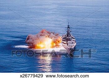 Stock Photograph - battleship, combat, 
daylight, explosion, 
fire, firing. 
fotosearch - search 
stock photos, 
pictures, images, 
and photo clipart