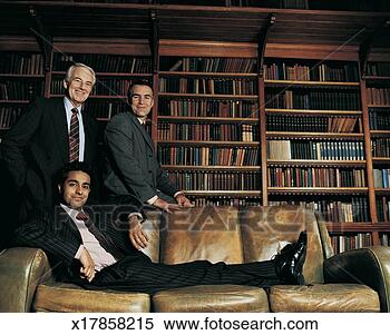 Stock Image - portrait of three 
male ceos in a 
room by a leather 
sofa with a large. 
fotosearch - search 
stock photos, 
pictures, images, 
and photo clipart