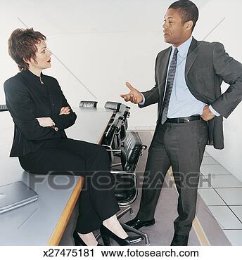 Stock Photography - two mature ceos 
having a face 
to face discussion 
in a boardroom. 
fotosearch - search 
stock photos, 
pictures, images, 
and photo clipart