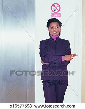 Stock Photo - young businesswoman 
smoking a cigarette 
below a no smoking 
sign. fotosearch 
- search stock 
photos, pictures, 
images, and photo 
clipart