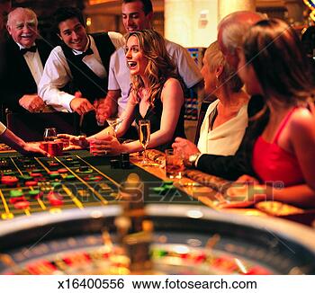 Stock Photo - woman being given 
gambling chips 
at a roulette 
table in a casino. 
fotosearch - search 
stock photos, 
pictures, images, 
and photo clipart