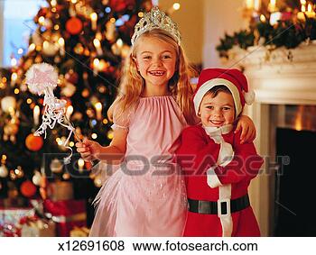 Stock Photo - portrait of a 
girl dressed in 
a fairy costume 
standing beside 
her. fotosearch 
- search stock 
photos, pictures, 
images, and photo 
clipart