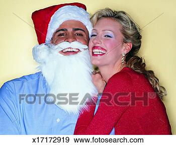 Stock Photograph - portrait of a 
woman with a man 
wearing a father 
christmas fancy 
dress. fotosearch 
- search stock 
photos, pictures, 
images, and photo 
clipart