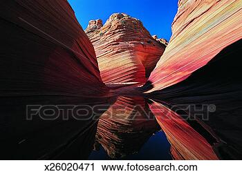Stock Photography - coyote buttes 
reflected in a 
puddle,  colorado 
plateau,  paria. 
fotosearch - search 
stock photos, 
pictures, images, 
and photo clipart