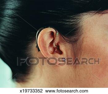 Stock Photo - close-up of woman 
wearing a hearing 
aid. fotosearch 
- search stock 
photos, pictures, 
images, and photo 
clipart