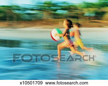 Stock Photograph - brother and sister 
holding beach 
balls and running 
across the beach. 
fotosearch - search 
stock photos, 
pictures, images, 
and photo clipart