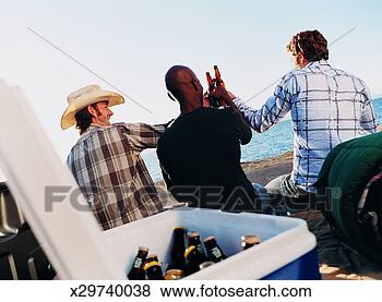 Stock Photo - three men looking 
at the ocean view 
and making a toast 
with bottles. 
fotosearch - search 
stock photos, 
pictures, images, 
and photo clipart