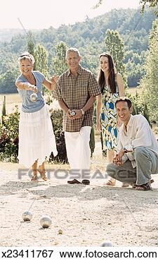 Picture - mature couple 
play boules with 
their grown-up 
children. fotosearch 
- search stock 
photos, pictures, 
images, and photo 
clipart