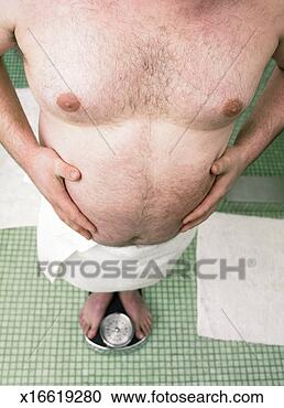 Stock Photography - man weighing himself 
on bathroom scales. 
fotosearch - search 
stock photos, 
pictures, images, 
and photo clipart