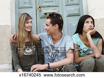 Stock Image - teenage couple 
sit to face to 
face on a doorstep, 
 teenage girl 
sit. fotosearch 
- search stock 
photos, pictures, 
images, and photo 
clipart