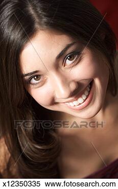 Stock Image - a beautiful caucasian 
brunette female 
looks up at the 
camera and. fotosearch 
- search stock 
photos, pictures, 
images, and photo 
clipart