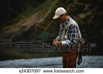 Picture - man fly fishing. 
fotosearch - search 
stock photos, 
pictures, images, 
and photo clipart