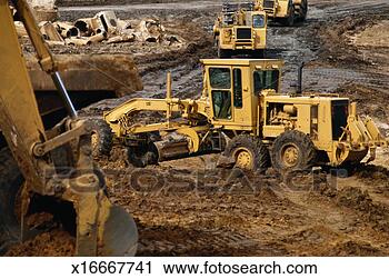Stock Photography - heavy machinery 
being used for 
land excavation. 
fotosearch - search 
stock photos, 
pictures, images, 
and photo clipart