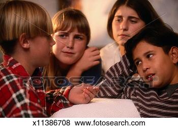 Stock Photo - child offering 
marijuana to other 
children. fotosearch 
- search stock 
photos, pictures, 
images, and photo 
clipart