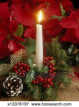 Christmas candle burning, close-up View Large Photo Image Picture - christmas candle burning, close-up. fotosearch - search stock photos, pictures, images, and photo clipart