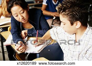 Stock Photograph - teenage boy and 
teenage girl exchanging 
notes. fotosearch 
- search stock 
photos, pictures, 
images, and photo 
clipart