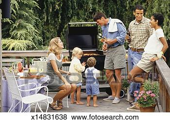 Stock Photo - two couples and 
two children (2-3, 
4-5) barbecuing 
on patio. fotosearch 
- search stock 
photos, pictures, 
images, and photo 
clipart