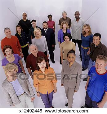 Stock Image - large group of 
adults standing 
side by side, 
 posing in studio. 
fotosearch - search 
stock photos, 
pictures, images, 
and photo clipart
