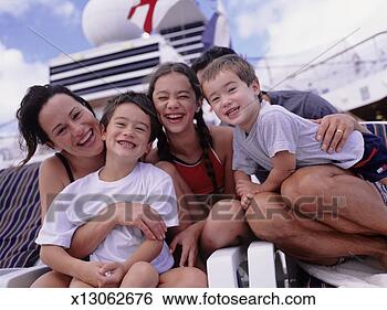 Stock Photo - parents with sons 
(4-5) (6-7) daughter 
(10-11) sitting 
on deckchair. 
fotosearch - search 
stock photos, 
pictures, images, 
and photo clipart