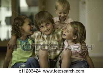 Stock Photo - four children 
(3-4), sitting 
together in home, 
portrait. fotosearch 
- search stock 
photos, pictures, 
images, and photo 
clipart