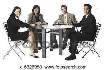 Stock Photo - a group of four 
business people 
sit around a table 
and smile. fotosearch 
- search stock 
photos, pictures, 
images, and photo 
clipart