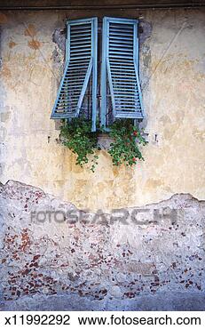 Stock Photo - tuscany, italy 
-- shutters with 
geraniums. fotosearch 
- search stock 
photos, pictures, 
images, and photo 
clipart
