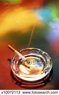 Stock Photo - cigarette burning 
in ashtray. fotosearch 
- search stock 
photos, pictures, 
images, and photo 
clipart