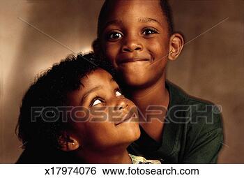 Stock Photo - two happy children 
an african-american 
boy who is wearing 
a green. fotosearch 
- search stock 
photos, pictures, 
images, and photo 
clipart