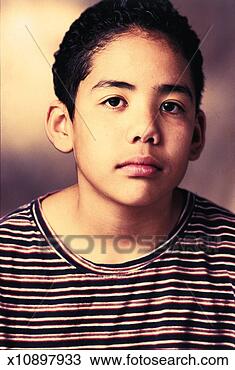 Stock Photo - unhappy older 
boy with black 
hair wearing a 
striped shirt 
looks off. fotosearch 
- search stock 
photos, pictures, 
images, and photo 
clipart