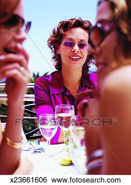 Stock Photo - three woman chatting 
over lunch. fotosearch 
- search stock 
photos, pictures, 
images, and photo 
clipart