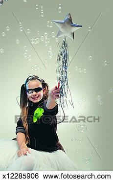 Stock Photo - portrait of a 
young girl in 
shades holding 
a magic wand with 
bubbles. fotosearch 
- search stock 
photos, pictures, 
images, and photo 
clipart