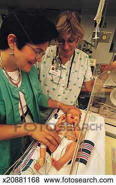 Stock Photo - doctor and nurse 
caring for premature 
baby in intensive 
care. fotosearch 
- search stock 
photos, pictures, 
images, and photo 
clipart