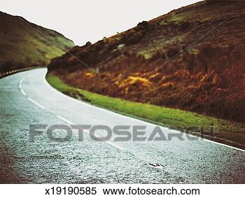 Stock Image - curve in a country 
road, lake district, 
united kingdom. 
fotosearch - search 
stock photos, 
pictures, images, 
and photo clipart