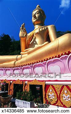 Stock Image - golden statue 
of the buddha 
sitting cross 
legged,  phuket 
town. fotosearch 
- search stock 
photos, pictures, 
images, and photo 
clipart