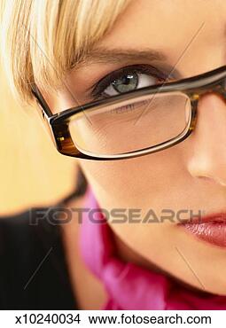 Stock Photo - close-up cropped 
portrait of a 
young businesswoman 
wearing spectacles. 
fotosearch - search 
stock photos, 
pictures, images, 
and photo clipart